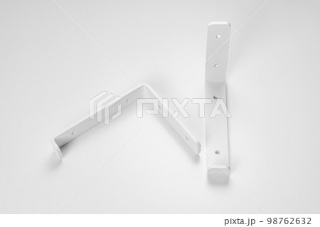 Bracket on a white background. support part for mounting shelves. Bracket on a white background. support part for mounting shelves. 98762632
