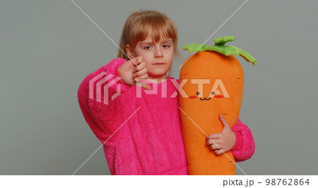 Upset preteen child girl showing thumbs down, dislike bad work, disapproval, dissatisfied feedback Upset preteen child girl showing thumbs down, dislike bad work, disapproval, dissatisfied feedback 98762864