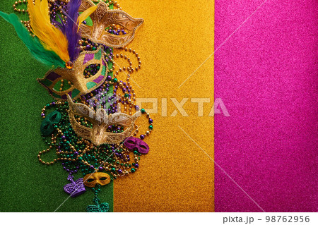 Mardi gras, Venetian or Carnivale mask on on a tricolor shining background. Mardi gras, Venetian or Carnivale mask on on a tricolor shining background. 98762956