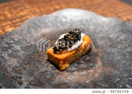 Luxury caviar toast with truffle cream sauce Luxury caviar toast with truffle cream sauce 98766348