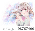 胸の前で手を組む少女/泣き顔/パステル背景 98767400
