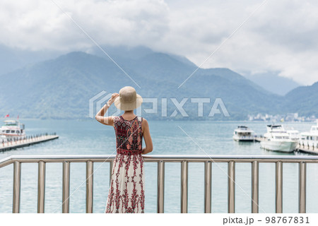 traveling Asian woman with hat 98767831