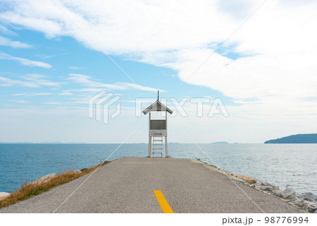 White Wooden Tower observation old small at the end of road. 98776994