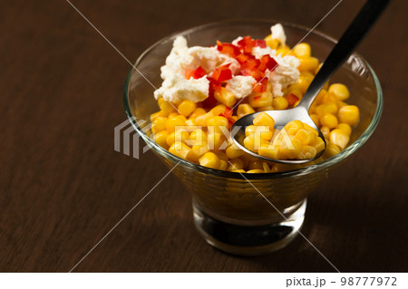 Esquites or Trolley with corn, cheese, mayonnaise and chili. Mexican street food 98777972