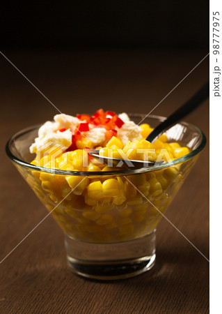 Esquites with corn, cheese, mayonnaise and chili. Mexican street food 98777975