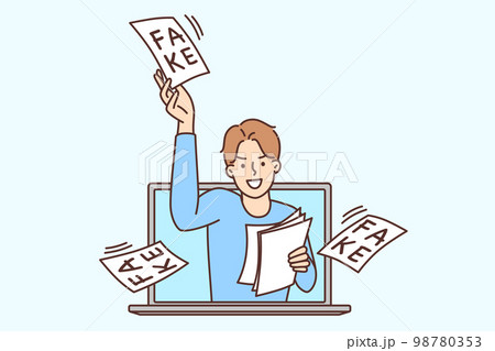 Man looks out of laptop screen scattering pieces of paper with inscription fake Man looks out of laptop screen scattering pieces of paper with inscription fake 98780353
