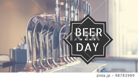 Image of beer day text and close up of beer tabs in bar Image of beer day text and close up of beer tabs in bar 98783989