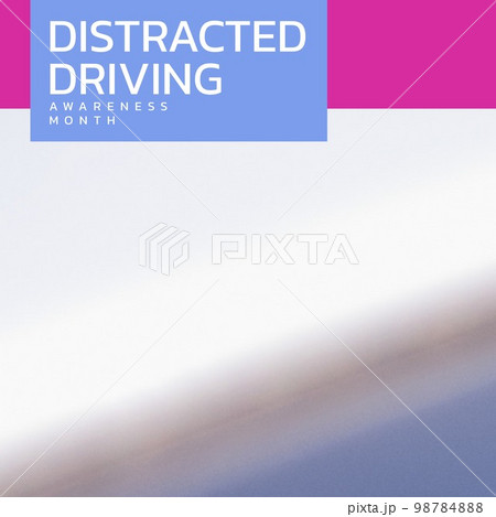 Composition of distracted driving awareness month text over blurred background 98784888