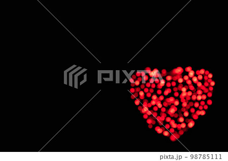 Red heart of glitter circles lights as an abstract Valentines Day festive background with copy space Red heart of glitter circles lights as an abstract Valentines Day festive background with copy space 98785111