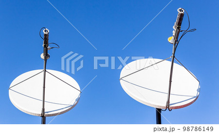 Satellite Dishes Two Blue Sky 98786149