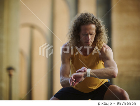 Runner checking smart watch 98786858