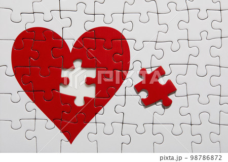 Jigsaw puzzle with red heart Jigsaw puzzle with red heart 98786872