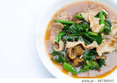 Fried flat noodle with pork and kale in gravy sauce Fried flat noodle with pork and kale in gravy sauce 98788945