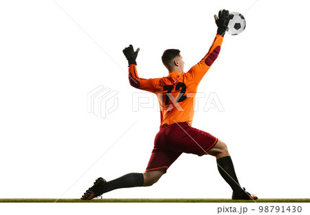 Professional soccer football goalkeeper in action, motion isolated over white studio background. Concept of sport, achievement, competition, goals. Back view Professional soccer football goalkeeper in action, motion isolated over white studio background. Concept of sport, achievement, competition, goals. Back view 98791430