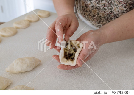 Yeast dough using to make buns with potatoes, on white countertop, at home 98793805