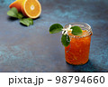 orange jam in a glass jar 98794660