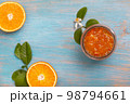 orange jam in a glass jar 98794661