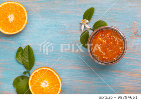orange jam in a glass jar 98794661