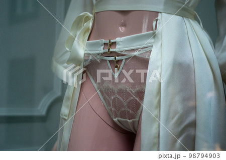 closeup of satin underwear on mannequin in fashion store for women 98794903