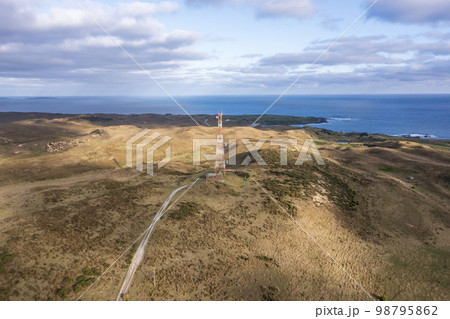 Drone aerial photograph of a communications tower on King Island 98795862
