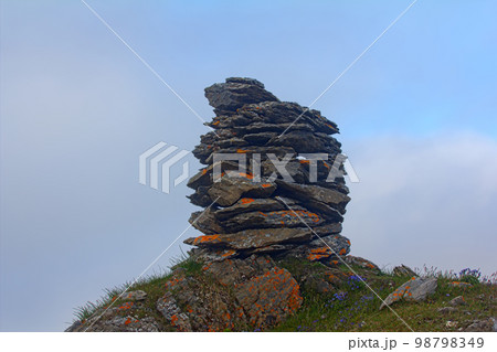 Built from stone Cairn at sunset, at midnight, the polar day Built from stone Cairn at sunset, at midnight, the polar day 98798349