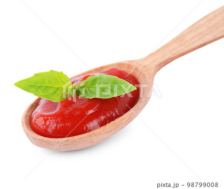 Tasty tomato sauce in spoon isolated on white Tasty tomato sauce in spoon isolated on white 98799008