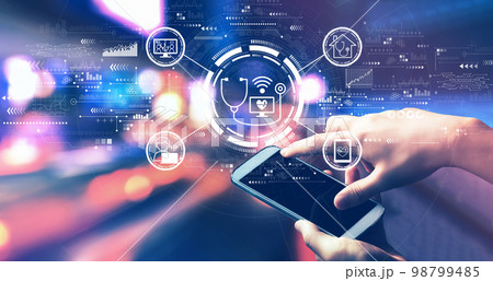 Telemedicine theme with person using a smartphone at night Telemedicine theme with person using a smartphone at night 98799485