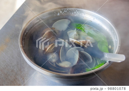 Close up shot of a hot clam soup 98801078