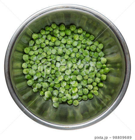Frozen green peas in a metal bowl, reflected on the sides, on a white background 98809689