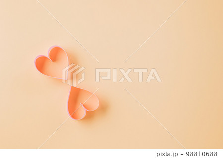 Happy Valentines Day. Above pink ribbon heart shaped decorative symbol isolated on pastel background, love romance concept, template banner design with copy space, Mother, Woman day 98810688