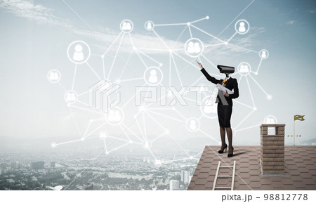 Concept of security and privacy protection with camera headed woman Concept of security and privacy protection with camera headed woman 98812778