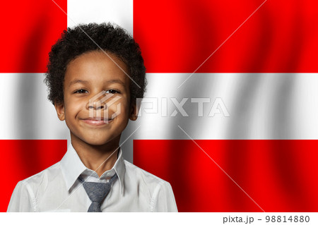Danish kid boy on flag of Denmark background. Education and childhood concept 98814880