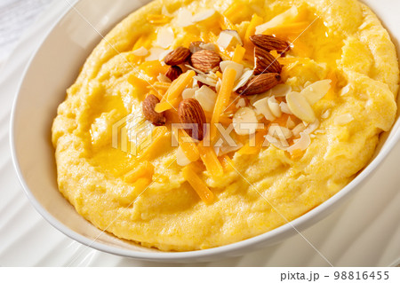 corn grits with butter, vegan cheese, and almonds corn grits with butter, vegan cheese, and almonds 98816455