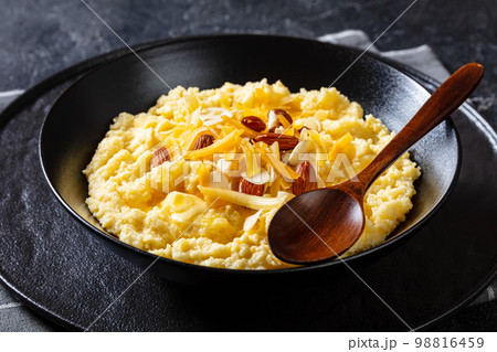 corn grits with butter, vegan cheese, and almonds corn grits with butter, vegan cheese, and almonds 98816459