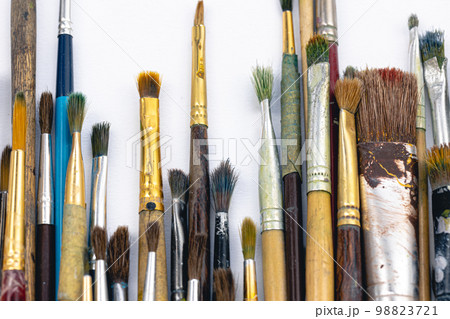 Close-up, old paint brushes on a white background. 98823721