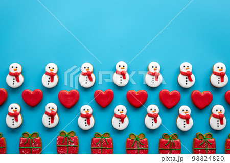 Christmas gingerbread on a blue background, flat lay. 98824820
