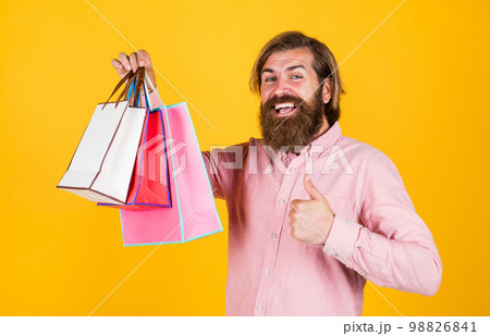 best day ever. mature hipster with beard hold present pack. brutal caucasian hipster with gift. male go shopping with purchase. successful shopaholic. bearded man ready for holiday. sale and discount best day ever. mature hipster with beard hold present pack. brutal caucasian hipster with gift. male go shopping with purchase. successful shopaholic. bearded man ready for holiday. sale and discount 98826841