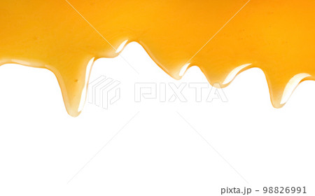 Fresh sweet honey flowing on white background Fresh sweet honey flowing on white background 98826991