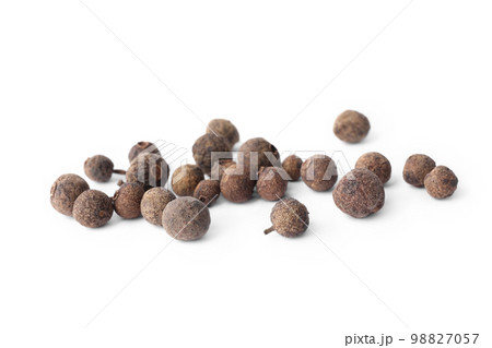 Spicy black pepper grains isolated on white Spicy black pepper grains isolated on white 98827057