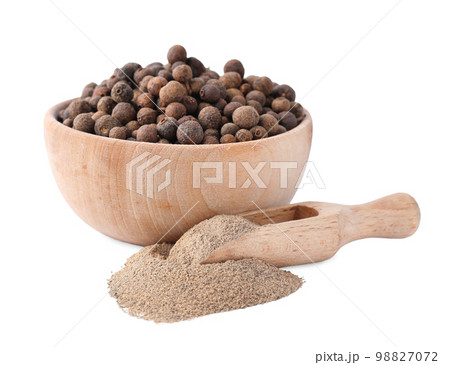 Spicy milled and whole black pepper isolated on white Spicy milled and whole black pepper isolated on white 98827072