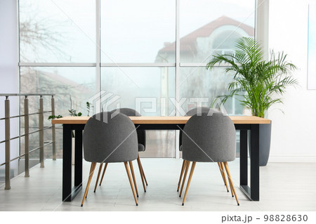 Modern room interior with chairs and table Modern room interior with chairs and table 98828630