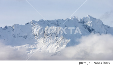 Tantalus Range covered in Snow and Clouds during Winter Season. 98831065