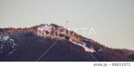 Grouse Mountain Ski Resort and Wind Turbine at winter sunrise. Grouse Mountain Ski Resort and Wind Turbine at winter sunrise. 98831072