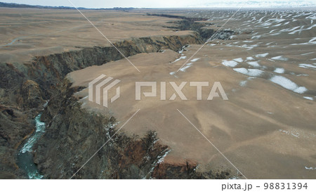 The Grand Canyon in the steppe with emerald River The Grand Canyon in the steppe with emerald River 98831394