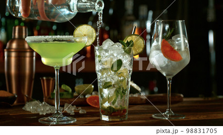 Fresh various cocktails on the bar, dark toned background 98831705