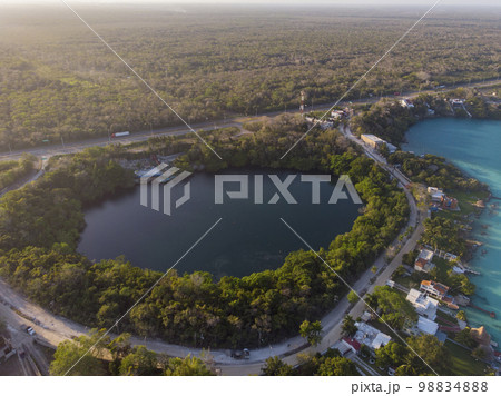 Aerial Drone Shot of Beautiful Cenote Azul and view on 7 seven colors lagoon in Bacalar, Quintana Roo, Mexico Aerial Drone Shot of Beautiful Cenote Azul and view on 7 seven colors lagoon in Bacalar, Quintana Roo, Mexico 98834888