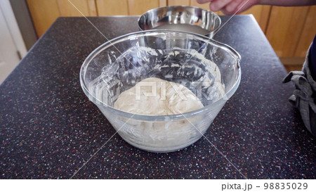 Step by step. Baking sourdough bread in residential kitchen. Step by step. Baking sourdough bread in residential kitchen. 98835029