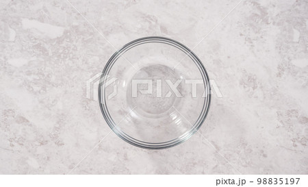 Flat lay. Step by step. Mixing ingredients to bake unicorn rainbow chocolate cupcakes. 98835197