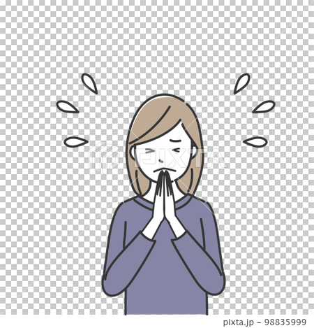 A woman praying with her hands together 98835999