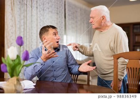 Senior man and his son quarreling 98836349
